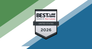 Graphic featuring a silver badge with the text “Best Law Firms – Ranked by Best Lawyers – United States 2026.” The badge is centered on a background with diagonal stripes in green, white, and blue tones.