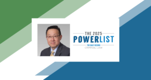 A professional headshot of an adult man wearing glasses, a suit and tie, displayed alongside a graphic that reads “The 2025 Power List – The Daily Record – Criminal Law” on a background with overlapping green and blue geometric shapes.